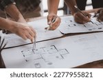 Small photo of Architects and engineers are working together to edit the draft house plan that was designed after it was presented to the client and partially revised the design. Interior design and decoration ideas