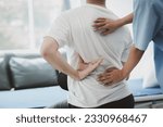 Small photo of Physiotherapist doing physiotherapy for patient in a hospital room, physiotherapy helps to recover from illness by moving the body and muscles. The concept of treating illnesses with physical therapy.