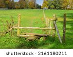Scenic View Of A Wooden Stile...