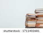 a lot of stacks of educational books in the library on a white background