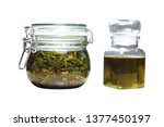 Small photo of Natural homemade healing herbs macerate. Curative herb macerating in olive oil in a glass preserving jar.