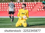 Small photo of La Nucia, Spain – January 11, 2023. FC Augsburg goalkeeper Tomas Koubek after conceding a goal during club friendly Ferencvaros vs Augsburg (2-0).