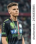 Small photo of Budapest, Hungary – May 11, 2022. Paks centre-back Oliver Tamas with a finalist medal after Hungarian Cup 202122 final match Ferencvaros vs Paks (3-0).