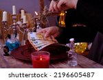 Small photo of seance in salon of soothsayer, Librate with money, female hands of psychic doing witchcraft passes with euro banknotes, esoteric Oracle performs ritual of removing spell black magic, esoteric business