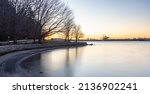 Small photo of Panoramic View of Seawall in the modern City on West Coast Pacific Ocean. Sunny Winter Sunrise. Seawall at Stanley Park, Coal Harbour, Downtown Vancouver, British Columbia, Canada.