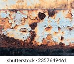 Small photo of "The old train caboose, weathered by time and corroded by rust, has developed a captivating blend of patterns and a beautiful, intriguing surface."