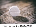 white round pill paracetamol or aspirin. Painkiller remedy