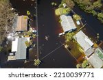 Small photo of Hurricane Ian flooded houses in Florida residential area. Natural disaster and its consequences