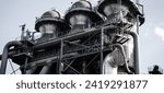 Small photo of Embark on a visual exploration of industrial prowess with this compelling collection of Shutterstock images, showcasing the commanding presence of a gray factory. Each photograph captures the essence