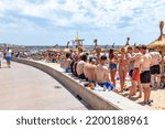 Small photo of Palma de Mallorca, Spain - June 22, 2022: beach at gate 6 with promenade in Palma de Mallorca, called in German Ballermann - engl. Funman.