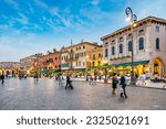 Small photo of Verona, Italy - August 4, 2009: people at Piazza Bra at the old roman Amphitheater in Verona, Italy.