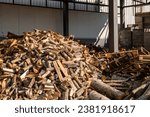 Stacking Firewood. Pile of firewood loggs. Preparation for winter heating season. Firewood background