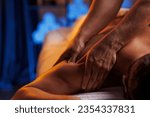Small photo of Physiotherapist massaging male patient with damaged shoulder muscle, treating sports injuries. Relaxing professional shoulder massage in cozy atmosphere, reboot on the weekend, end of difficult week.