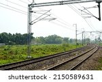 Small photo of SILIGURI, INDIA - APRIL 14, 2022: A railway electrification system supplies electric power to railway trains and trams without an on-board prime mover or local fuel supply.