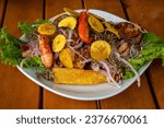 Small photo of Peruvian Pescado Frito, or fried fish, is a classic and straightforward Peruvian seafood dish that is appreciated for its crispy exterior and delicate flavor.
