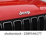 Small photo of Hilversum, the Netherlands - November 16, 2023: close up shot of the Jeep logo on a red Jeep Renegade crossover