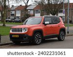 Small photo of Hilversum, the Netherlands - December 18, 2023: an orange Jeep Renegade compact crossover car