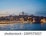 Small photo of Istanbul city skyline in Turkey, Beyoglu district old houses with Galata tower on top, view from the Golden Horn