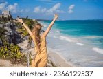 Small photo of Woman tourist enjoying the view Pre-Columbian Mayan walled city of Tulum, Quintana Roo, Mexico, North America, Tulum, Mexico. El Castillo - castle the Mayan city of Tulum main temple