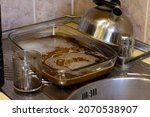 pile of dirty dishes in sink... | Shutterstock . vector #2070538907