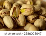 Small photo of "Indulge in the exquisite details of a bountiful pistachio harvest. This high-quality closeup captures the vibrant green hues and irresistible textures, making it a perfect visual treat for culinary a