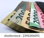 Small photo of rupiah money in the wallet with White baground,banknote. IDR 100.000. IDR 20.000. IDR 10.000 IDR 5000,2000
