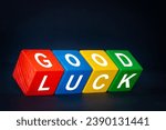 Small photo of Good Luck symbol. Positive multicolored wooden blocs with the words Good Luck. Beautiful navy blue background, business and good luck concept. Copy space
