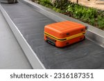 Small photo of Luggage suitcase on the conveyor wait for passenger come to claim it at Terminal 3, Changi Airport, Singapore