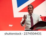 Small photo of Liverpool, United Kingdom - October 10 2023: Labour Party Conference. Leader of the Opposition, Sir Keir Starmer speaking to conference, sleeves rolled up and covered in glitter from a recent protest