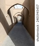 Small photo of A narrow alleyway with arches, whispered secrets of a bygone era