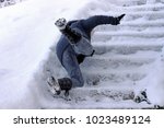 A woman slipped and fell on a wintry staircase. Fall on smooth steps
