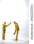 Small photo of A young couple seemed to be arguing because they had a disagreement. a wooden mannequin as a model and photographed on an isolated white background. concept of falling in love