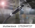 Type-C USB cable on an industrial background.