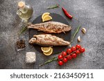 baked trout on a stone background