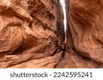 Two large rock faces come together to create a slot canyon of sorts inside the Fiery Furnace in Arches National Park near Moab, Utah.
