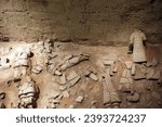 Small photo of Xian, Shaanxi Provice, China, Asia - 10 26 2009 : detail photo of the famous chinese Terracota army in Xi'an but with beheaded broken destroyed soldiers in dry soil earth dust