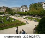 Small photo of Paris XV, France, Europe - 09 26 2007 : Exterior photo cityscape view of the Parisian Saint Lambert public garden park of the 15th XVth distrcit of the french capital during the ween end with families