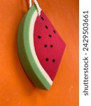 A watermelon shaped bath sponge ...