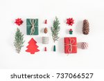 Christmas composition. Christmas gifts, pine branches, toys on white background. Flat lay, top view.