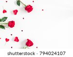 Flowers composition. Frame made of rose flowers, confetti on white background. Valentine's Day background. Flat lay, top view, copy space.