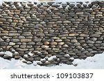 Old Stone Wall Of Snow Covered