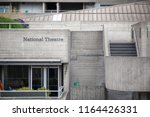 The signage and Brutalist architecture of the National Theatre in the South Bank area, London