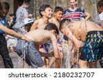 Small photo of London, UK - 18 July, 2022 - Heatwave in London, children playing with water to cool at the fountains at Granary Square in Kings Cross