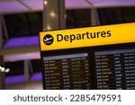 Small photo of Flight information, arrival and departure board at Heathrow Airport in London, England