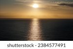 Small photo of A stunning summer sunrise illuminates the serene waters of Kwazulu Natal, creating a picturesque scene of tranquility with barely a ripple and gentle, balmy breezes.