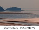 Small photo of Channel filling with the water of the rising tide in the Minas Basin, Nova Scotia, Canada.