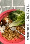 Small photo of Meggi or instant noodle or indomee with half boiled egg and baby romaine lettuce.