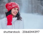 beautiful woman portrait outdoors in snowed forest copy space