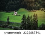 Small photo of St Magdalena church in Val di Funes valley, Dolomites, Italy. Furchetta and Sass Rigais mountain peaks in background.