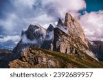 Small photo of A man in front of epic Furchetta and Sass Rigais peaks in Seceda, Dolomites Alps, Odle mountain range, South Tyrol, Italy, Europe. Travel vacation concept.